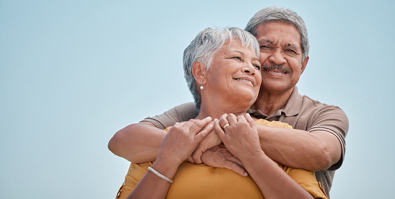 Love, senior couple and hug being happy together, bonding and embrace for anniversary, marriage and smile. Romantic, elderly man and woman celebrate relationship, for romance or loving for happiness.